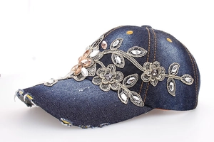 Distressed dark blue denim baseball cap with gold floral embroidery and rhinestones