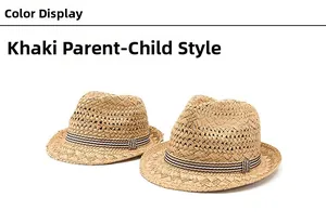 Detail of khaki straw sun hats with black and white striped bands in a parent-child set