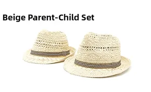 Detail of beige straw panama hats with striped ribbons for adult and child set