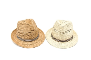 Detailed macro view of woven straw sun hats with tri-color striped decorative bands