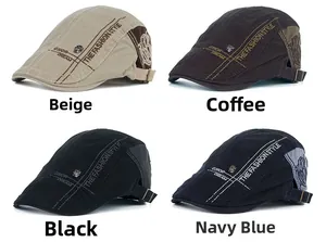 Detail view of four vintage flat caps with embroidered fashion style letters and metal buckles