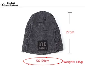Detail of dark gray knit beanie showing size dimensions and warm wool texture