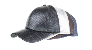 Detailed macro view of the embossed crocodile pattern texture on the PU baseball caps