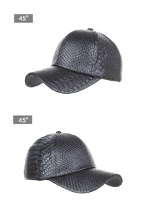 Detailed macro view showing the crocodile texture on the black faux leather baseball cap