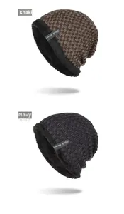 Detail view of khaki and navy blue checkered beanies with soft fleece lining and logo