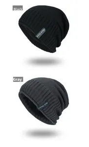 Vertical view of black and grey ribbed knit beanies with fleece lining and woven labels