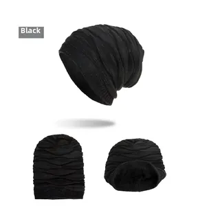 Detail view of black knit beanie with plush fleece lining and thick wave texture