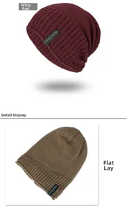 Detail view of ribbed wine red beanie with black humor tag and soft knitted texture