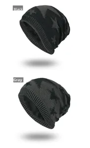 Detail view of knitted beanie with star pattern and warm fleece lining in black and grey