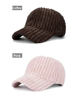 Detail view of coffee and pink corduroy baseball caps showing ribbed fabric texture