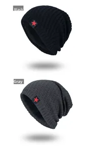 Detail view of knitted beanie hats in black and grey with red star patch and fleece lining