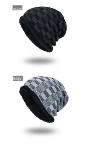 Detail of warm winter beanies showing checkered knit texture and fleece lining inside
