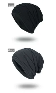 Close-up of black and gray knit beanies with warm fleece lining and diamond pattern