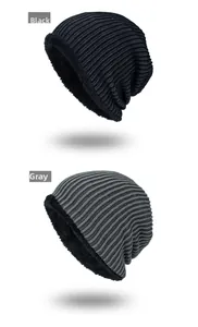 Close-up of winter knitted beanie showing warm fleece lining and striped texture