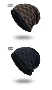 Detail of knitted beanie with plush lining in khaki and navy blue colors