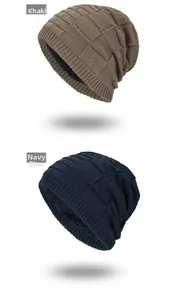 Detail of khaki and navy blue knit beanies with thick fleece lining for winter warmth