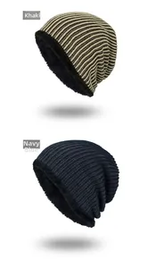 Detail view of khaki and navy striped knit beanies with warm black fleece lining