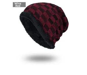 Detail view of wine red checkered knit hat with thick black warm fleece lining