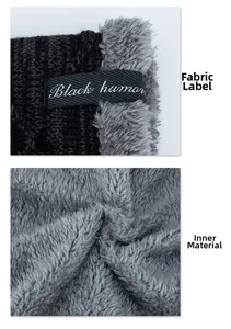 Close-up of winter knit hat with soft gray fleece lining and Black humor cloth label