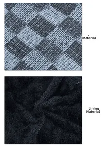 Detail of grey knitted fabric with warm black fleece lining material for winter hats