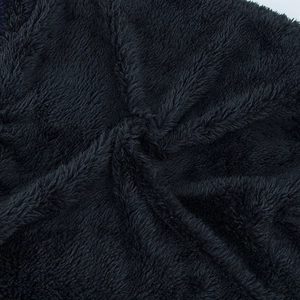 Close-up of black fleece lining on a winter knit beanie showing soft thermal texture