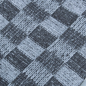 Winter knit beanie hat with gray and white checkered pattern and soft warm lining