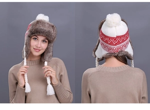 Detailed front and back view of a winter knit trapper hat with red geometric patterns