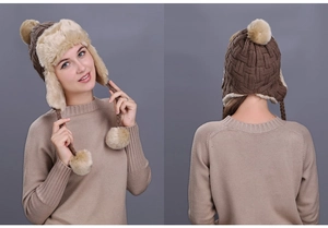 Detail of plaid earflap knit hat with faux fur lining and braided pom-pom drawstrings