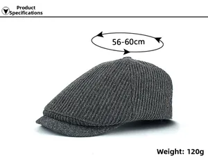 Detailed view of dark gray knit texture and metal side buckle on the winter flat cap