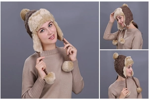 Detailed macro view of the thick faux fur lining and knit texture on the earflap hat