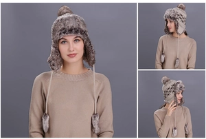 Close-up of winter aviator hat featuring plush faux fur lining and knit snowflake patterns
