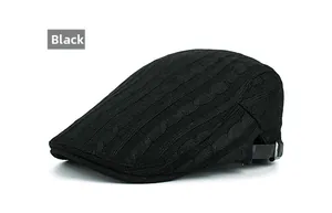 Detailed view of black cable knit beret cap with adjustable strap for winter