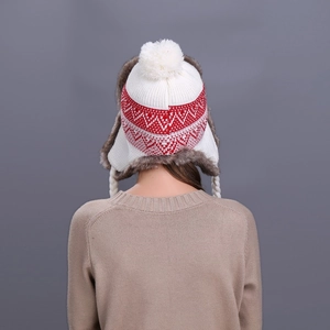 Winter knit trapper hat in red and white with faux fur lining and ear flaps shown from behind