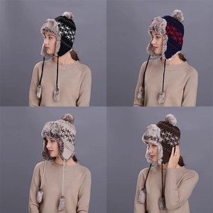 Winter trapper hat with pom-poms and faux fur lining in four classic colors