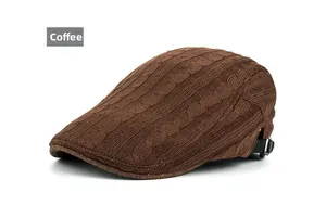 Detail showing knit cable texture and adjustable metal buckle on a coffee beret cap
