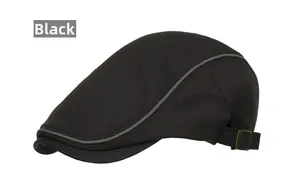 Detailed side view of black ivy cap showing metal buckle and grey piping trim on brim