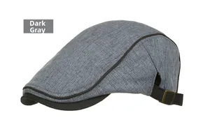 Detail of dark grey textured fabric beret hat with adjustable strap and metal buckle