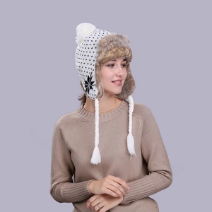 Winter snowflake knit trapper hat with faux fur lining and plush earflaps in white