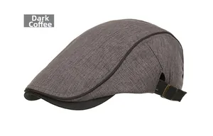 Detail of dark coffee textured peak cap with adjustable black strap and metal buckle