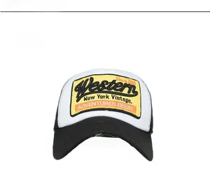 Close-up of vintage trucker hat featuring yellow embroidered patch and mesh back