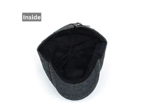Detailed inside view of grey wool tweed newsboy cap showing black lining and metal buckle