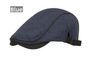 Detailed view of dark blue textured fabric hat with black brim and bronze buckle adjustment