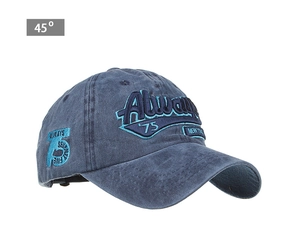 Detail view of navy blue washed cotton baseball cap with vintage 3D embroidery at 45 degree angle