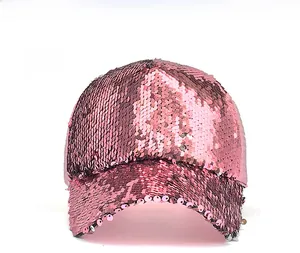 Detail of pink sequin baseball cap showing shiny metallic texture and sparkle effect