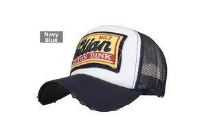 Close-up of distressed brim and Indian embroidery patch on navy trucker cap