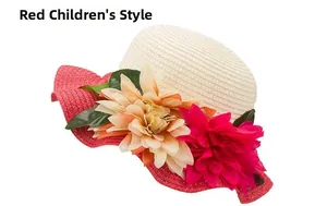 Detail of kids straw sun hat featuring red wavy brim and large floral decorations