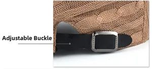 Close-up of brown cable knit hat featuring black leather strap and metal adjustment buckle