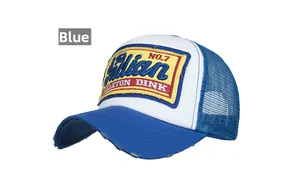 Detail of blue and white trucker hat featuring vintage embroidery and distressed brim