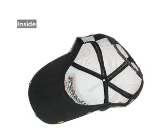 Detailed interior view of black mesh trucker hat with cotton fabric and washing label