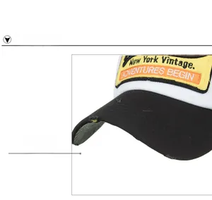 Detail of worn-out black brim and vintage New York embroidery on washed cotton baseball cap
